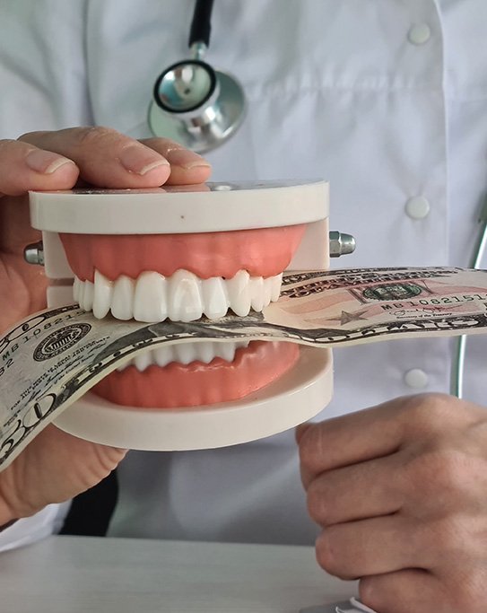 Dental team member showing a form to a patient