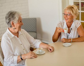 Ladies converse over coffee